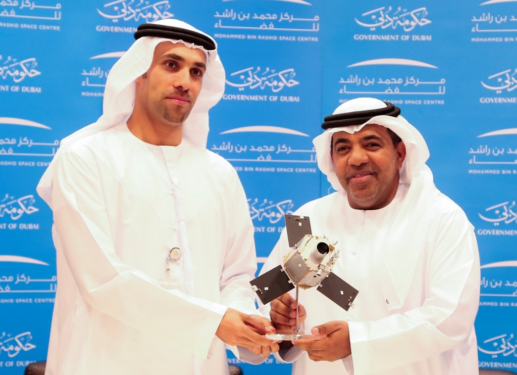 Ahmad Al Haddabi, Chief Operations Officer at Abu Dhabi Airports, and Salem Humaid Al Marri, Assistant Director General for Scientific and Technical Affairs at MBRSC, pose for a picture after signing a Memorandum of Understanding
