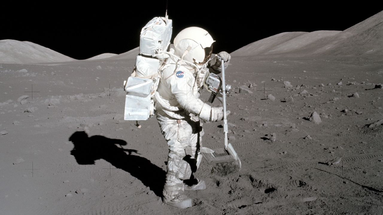 Scientist-astronaut Harrison H. Schmitt, Apollo 17 lunar module pilot, collects lunar rake samples at Station 1 during the mission's first spacewalk at the Taurus-Littrow landing site. Credit: NASA