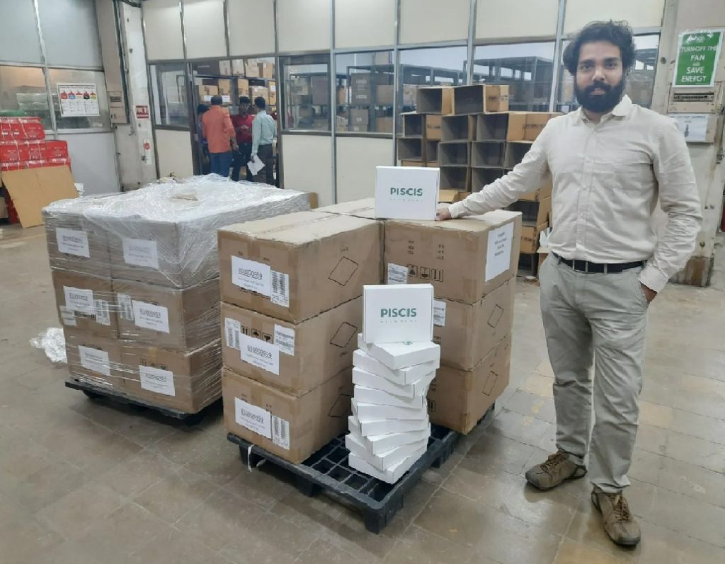 Piscis Networks founder and CEO Mandar Lokegaonkar with a batch of the startups SDWAN routers. Credit Piscis Networks