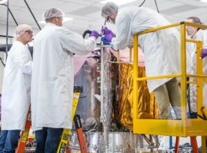 Astrobotic engineers working on Peregrine lander. Credit Astrobotic