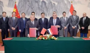 CNSA's Zhang Kejian (left) and Sherif Sedky (right) of EGSA sign a cooperation agreement on the ILRS in Beijing, Dec. 6., 2023. Credit CNSA