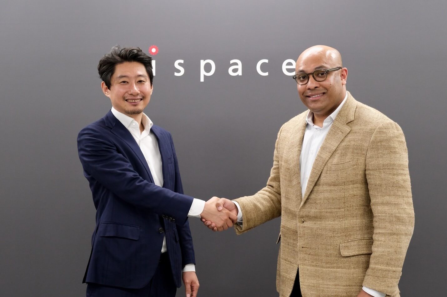 From Left: Takeshi Hakamada, Founder & CEO of ispace, inc., and Dr. Sakyasingha Dasgupta, Founder & CEO of EdgeCortix shake hands at a signing ceremony on Feb. 5, 2025, in Tokyo.