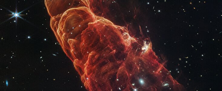Webb Space Telescope Image Reveals Herbig-Haro 49/50 and Spiral Galaxy