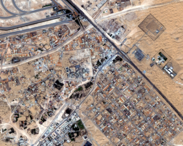 A rapidly expanding desert settlement in the UAE characterized by planned residential grids, major highway interchanges, and surrounding sand dune landscapes, as seen by EarthDaily’s EDC-01 satellite. Credit: Earth Daily