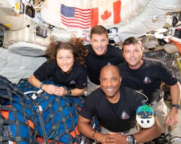 The Artemis II crew – (clockwise from left) Mission Specialist Christina Koch, Mission Specialist Jeremy Hansen, Commander Reid Wiseman, and Pilot Victor Glover – pause for a group photo with their zero gravity indicator "Rise," inside the Orion spacecraft on their way home. Following a swing around the far side of the Moon on April 6, 2026, the crew exited the lunar sphere of influence (the point at which the Moon's gravity has a stronger pull on Orion than the Earth's) on April 7, and are headed back to Earth for a splashdown in the Pacific Ocean on April 10. Credit: NASA
