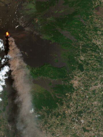 On 5 July 2026, the Copernicus Sentinel-2 mission captured this image of Mount Etna spewing lava and a massive plume of ash, gas and rock into the sky over the Italian island of Sicily.  Credit: ESA